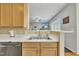 Kitchen sink with stainless steel sink and view into the living room at 1968 Shadow Glen Dr, Raleigh, NC 27604