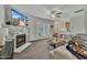 Cozy living room with a stone fireplace, carpet, fan, and comfortable seating at 1968 Shadow Glen Dr, Raleigh, NC 27604