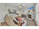 Comfortable living room showcasing a fireplace, decor, fan, and large sectional sofa at 1968 Shadow Glen Dr, Raleigh, NC 27604