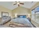 Spacious bedroom featuring a vaulted ceiling, ceiling fan, and rustic wood furniture set at 1968 Shadow Glen Dr, Raleigh, NC 27604