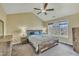 Main bedroom featuring large window and vaulted ceiling with a ceiling fan at 1968 Shadow Glen Dr, Raleigh, NC 27604