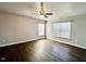 Large bedroom with dark hardwood floors, neutral paint, and windows at 204 Hillview Dr, Durham, NC 27703