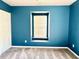 Bedroom features a window and neutral carpet at 204 Hillview Dr, Durham, NC 27703