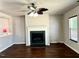 Open living room with fireplace, hardwood floors, and natural lighting at 204 Hillview Dr, Durham, NC 27703