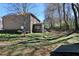 Large backyard showcasing the house, fencing, patio, and treed property line at 2144 Waterview Dr, Graham, NC 27253