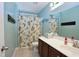 Bathroom featuring a shower with curtain, a vanity, and soft, neutral decor at 2144 Waterview Dr, Graham, NC 27253