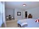 Bedroom with a built-in desk, carpeted floors, and light-colored walls at 2144 Waterview Dr, Graham, NC 27253