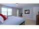 Bedroom featuring carpeted floors and a large window for natural light at 2144 Waterview Dr, Graham, NC 27253