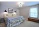 Bedroom featuring a large window for natural light, carpeted floors, and light-colored walls at 2144 Waterview Dr, Graham, NC 27253