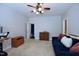 Inviting bedroom with an ensuite bathroom, soft carpet, a ceiling fan, and a spacious layout at 2144 Waterview Dr, Graham, NC 27253