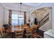 Elegant dining room featuring a coffered ceiling and modern light fixtures at 2144 Waterview Dr, Graham, NC 27253