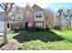 Charming two-story home with a manicured lawn and beautiful stone and siding exterior details at 2144 Waterview Dr, Graham, NC 27253