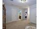 Upstairs hallway features neutral carpet and views of other rooms at 2144 Waterview Dr, Graham, NC 27253