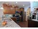 Modern kitchen with stainless steel appliances, ample cabinet space, and granite countertops at 2144 Waterview Dr, Graham, NC 27253