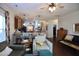 Open-concept living room features hardwood floors and a seamless flow into the kitchen at 2144 Waterview Dr, Graham, NC 27253