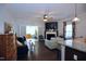 Bright living room featuring a fireplace, hardwood floors, and a seamless flow into the bright sunroom at 2144 Waterview Dr, Graham, NC 27253