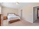 Bright bedroom featuring a cozy bed and neutral color palette at 2306 Stoney Spring Dr, Raleigh, NC 27610