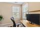 Bedroom designed as an office space and windows that allow plenty of natural light to enter at 2306 Stoney Spring Dr, Raleigh, NC 27610