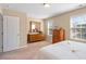 Bedroom featuring neutral color scheme and large, bright windows at 2306 Stoney Spring Dr, Raleigh, NC 27610