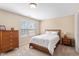 Cozy bedroom with a comfortable bed and natural light at 2306 Stoney Spring Dr, Raleigh, NC 27610