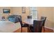 Cozy dining area with a table set for four, adjacent to the living room, creating an inviting space for meals at 2306 Stoney Spring Dr, Raleigh, NC 27610