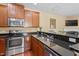 Well-equipped kitchen featuring stainless steel appliances and granite countertops at 2306 Stoney Spring Dr, Raleigh, NC 27610