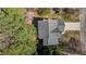An aerial view shows the roof and driveway of a residence on a sunny day at 2613 Coxindale Dr, Raleigh, NC 27615