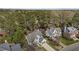 An aerial view of residences with lush landscaping and driveway on a sunny day at 2613 Coxindale Dr, Raleigh, NC 27615
