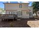 The back of the home features a two story house with a deck and bay windows on the first floor at 2613 Coxindale Dr, Raleigh, NC 27615