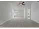 Spacious bedroom featuring plush carpet, a ceiling fan, and plenty of natural light at 2613 Coxindale Dr, Raleigh, NC 27615
