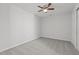 Neutral bedroom with ceiling fan and carpet flooring, providing a blank canvas for personalization at 2613 Coxindale Dr, Raleigh, NC 27615