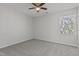 Neutral bedroom with natural light, ceiling fan, and carpet, ready for your personal touch at 2613 Coxindale Dr, Raleigh, NC 27615