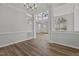 Open dining room features hardwood floors, neutral walls, and natural light at 2613 Coxindale Dr, Raleigh, NC 27615