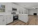 Bright kitchen features stainless steel appliances and an open floor plan at 2613 Coxindale Dr, Raleigh, NC 27615