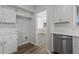 Bright kitchen features stainless steel appliances and access to the dining room at 2613 Coxindale Dr, Raleigh, NC 27615