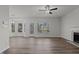 Spacious living room features hardwood floors, many windows, and access to the backyard at 2613 Coxindale Dr, Raleigh, NC 27615