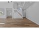 Open living room features hardwood floors, staircase, and adjacent dining area at 2613 Coxindale Dr, Raleigh, NC 27615