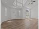 Spacious living room featuring hardwood floors, high ceilings, and a front door at 2613 Coxindale Dr, Raleigh, NC 27615