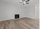 Spacious living room features hardwood floors, a fireplace, and neutral-colored walls at 2613 Coxindale Dr, Raleigh, NC 27615