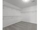 Walk-in closet with wire shelving and carpeted floor at 2613 Coxindale Dr, Raleigh, NC 27615