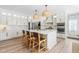 Open kitchen with a large island, stainless steel appliances and decorative pendant lights at 2720 Stratford Hall Dr, Raleigh, NC 27614