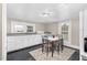 Cozy kitchen area with matching table and seating for four, bright overhead lighting, and outside views at 2785 Green Rd, Spring Hope, NC 27882