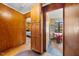 Inviting hallway featuring wooden accents leading to the kitchen at 2911 Broad St, Durham, NC 27704