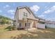 Backyard view featuring a covered patio, lawn, and the home's exterior under a bright sky at 300 Mariah Towns Way, Garner, NC 27529