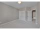 Neutral bedroom with a double door closet for storage and ensuite bathroom at 300 Mariah Towns Way, Garner, NC 27529