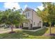 View of the townhome featuring established landscaping, a two-car garage, and classic siding at 300 Mariah Towns Way, Garner, NC 27529