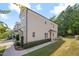 Exterior view of the townhome featuring classic siding, sidewalk, and manicured landscaping at 300 Mariah Towns Way, Garner, NC 27529