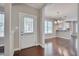 Open floor plan featuring hardwood floors, updated lighting, and white trim throughout at 300 Mariah Towns Way, Garner, NC 27529