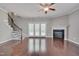 Spacious living room features hardwood floors, fireplace, staircase and natural light at 300 Mariah Towns Way, Garner, NC 27529