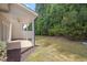 Covered patio provides shade and a relaxing view of the backyard and greenery at 300 Mariah Towns Way, Garner, NC 27529